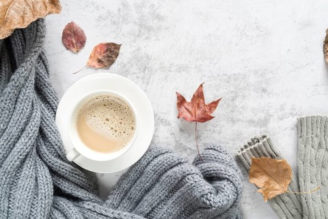 Hot beverage with warm sweater light surface