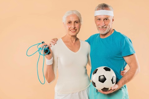 Modern senior couple with skipping rope football