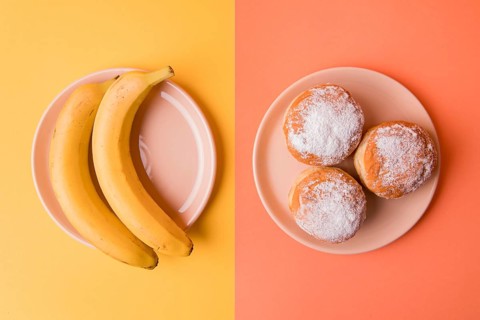 Top view bananas donuts