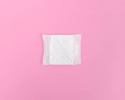 Closed sanitary towel pink background