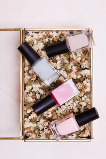 Pink gray nail varnish bottles dried white