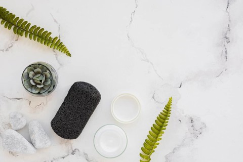 Top view bath products marble background with
