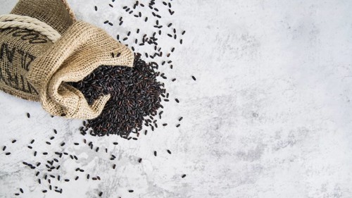 Composition scattered black rice sack