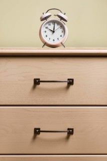 Alarm clock top wooden cabinet