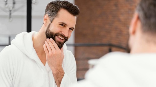 Man taking good care his face home