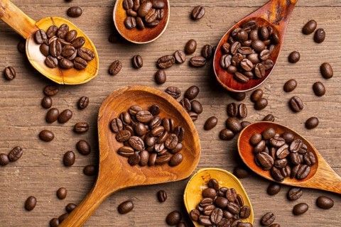 Flat lay coffee beans wooden spoons