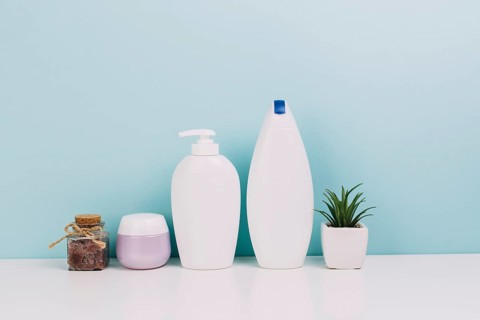 Plant near cosmetics bottles jar