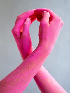 Close up painted arms expressing cancer awareness