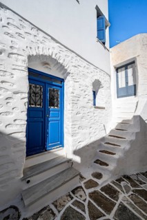 White Cycladic houses with blue doors and windows