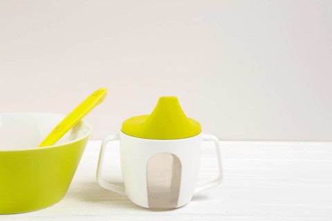 High angle bowl baby bottle with copy space