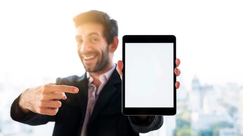 Hands showing tablet with blank screen