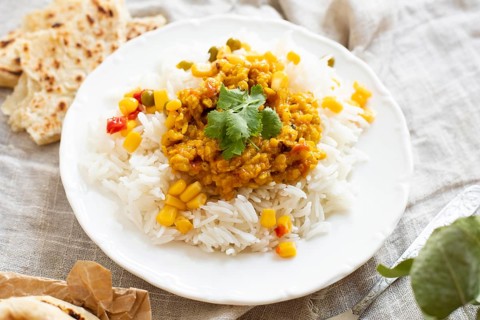 High angle rice with green peas corn