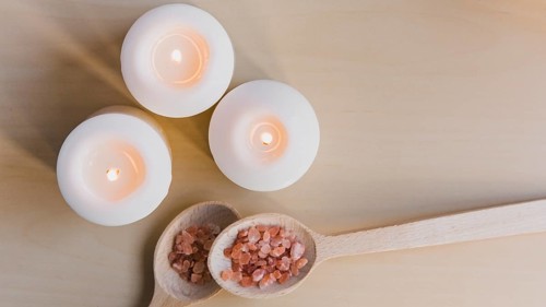 Flaming candles near salt