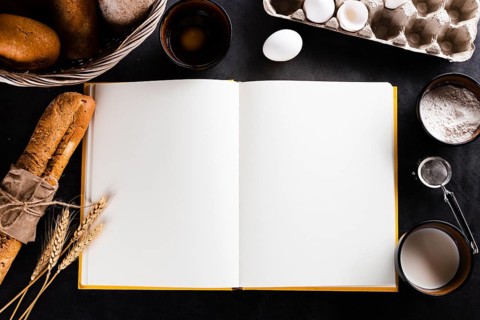 Flat lay notebook bread ingredients