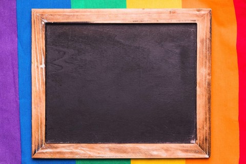 Empty blackboard rainbow background