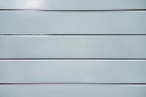 Texture light grey plastic panel wall