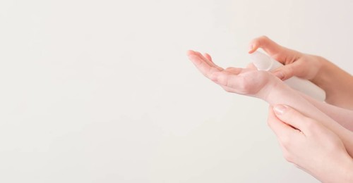Mom son using hand sanitizer