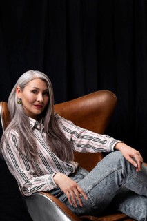 Side view beautiful senior woman portrait posing chair