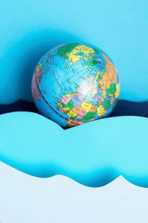 Top view earth globe with paper ocean waves
