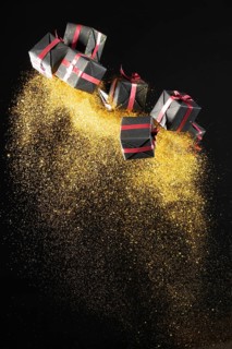Arrangement black friday gifts with golden glitter