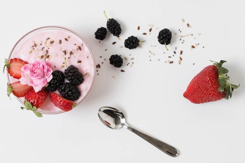 Top view fruit yoghurt with rose