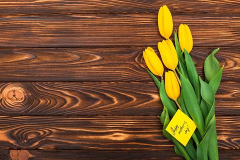 Happy mothers day inscription with tulip flowers