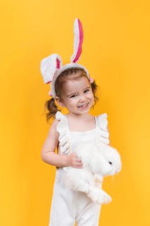 Cute girl bunny ears with rabbit