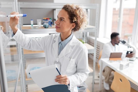 Researcher with clipboard biotechnology laboratory
