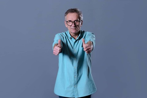 Man doing thumbs up gesture
