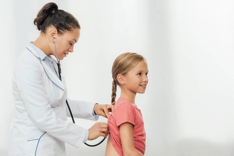 Medium shot doctor checking girl