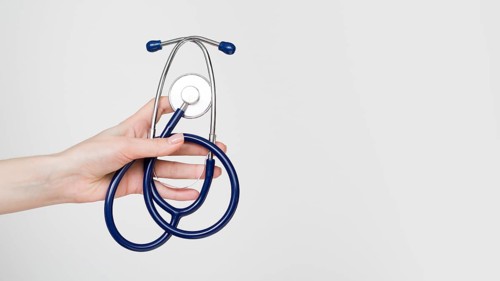 Close up hand holding stethoscope