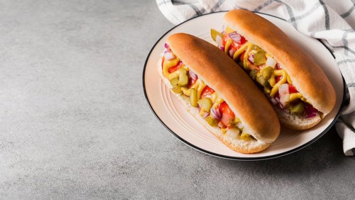 High angle hot dogs plate with copy space