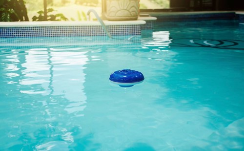 A chlorine float in a swimming pool. Dosing float for swimming pool chlorination
