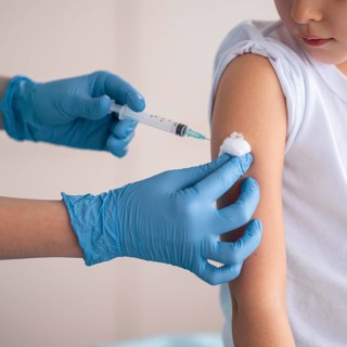 Little girl vaccinating coronavirus hospital