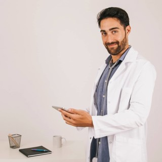 Happy medical doctor working with ipad