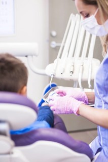 Female dentist looking teeth plaster mold clinic