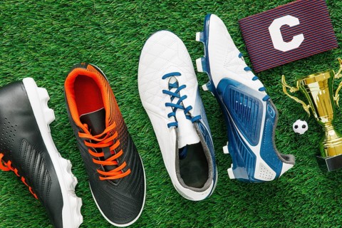 Football background grass with shoes