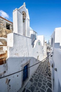 Small white church and Cycladic houses