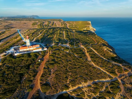 Aerial drone view of lighthouse on Cabo Espichel cape Espichel on Atlantic ocean
