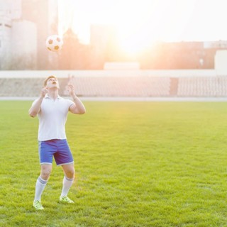 Young sportsman throwing ball