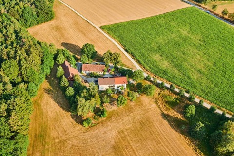 Aerial view over the fields and forests near Woerth an der Donau