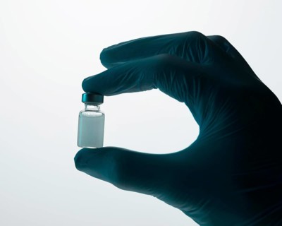 Doctor holding vaccine hand