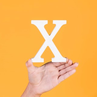 Female hand showing white alphabet x
