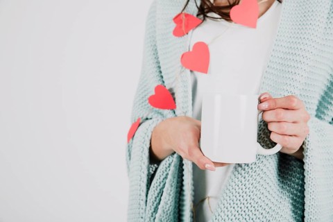 Crop woman plaid holding cup