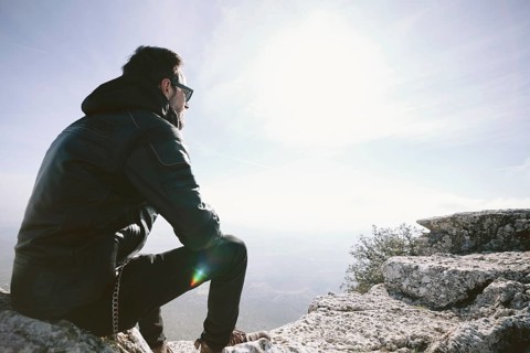 Man sitting rock