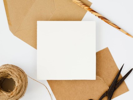 Top view arrangement white brown envelopes