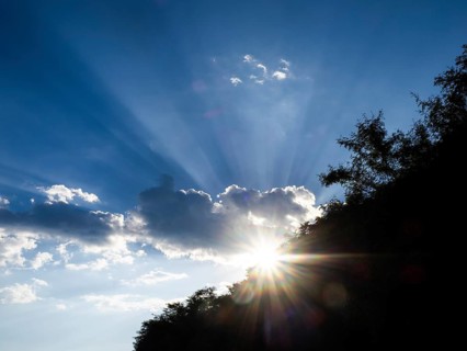 Rays of sunshine breaking through clouds