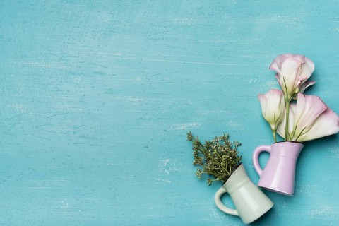 Beautiful vases blue textured wooden background