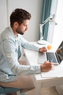 Casual adult male working from home
