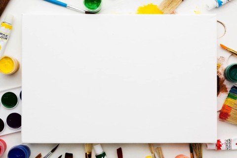 Copy space white canvas art studio items